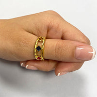 anillo ancho de plata de ley con baño de oro 18 kilates y 3 circonitas tipo rombo en color ámbar, ocre, azul y rojo. gold plated sterling silver cut out zircon ring