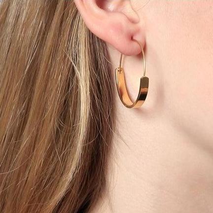 pendientes grandes de aro fino dorado o plateado. confeccionados en acero con baño de oro 18 kilates. Gold plated steel big thin hoop earrings