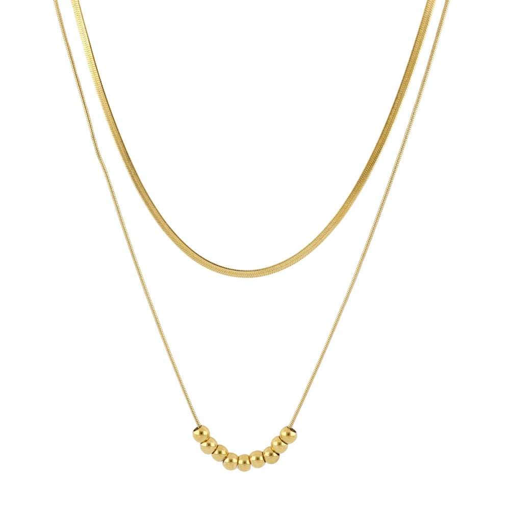 Collar boho de dos cadenas juntas, una de bolitas y otra de escama herringbone. Es de acero hipoalergénicos resistente al agua. Son 2 collares en 1.