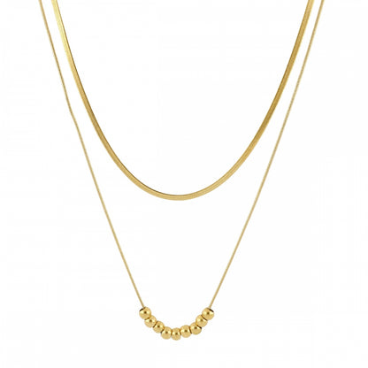 Collar boho de dos cadenas juntas, una de bolitas y otra de escama herringbone. Es de acero hipoalergénicos resistente al agua. Son 2 collares en 1.