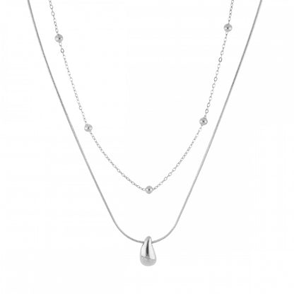 Collar boho de dos cadenas juntas, una de bolitas y otra con colgante de lágrima o gota. Es de acero hipoalergénicos resistente al agua. Son 2 collares en 1.