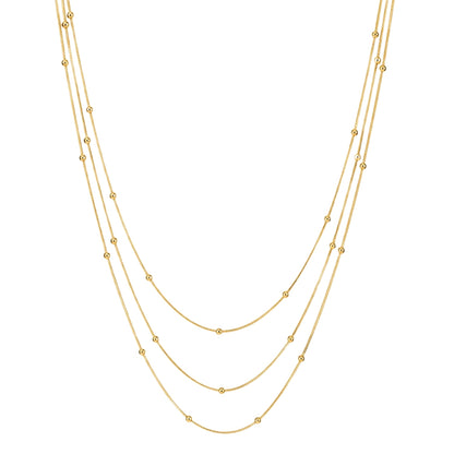 collar triple boho para adolescente o mujer joven que lleve escote palabra de honor, escote en v o escote pronunciado. es de 3 cadenas con bolitas. ideal para looks de noche o de fiesta. Es de acero hipoalergénico dorado o plateado y resistente al agua