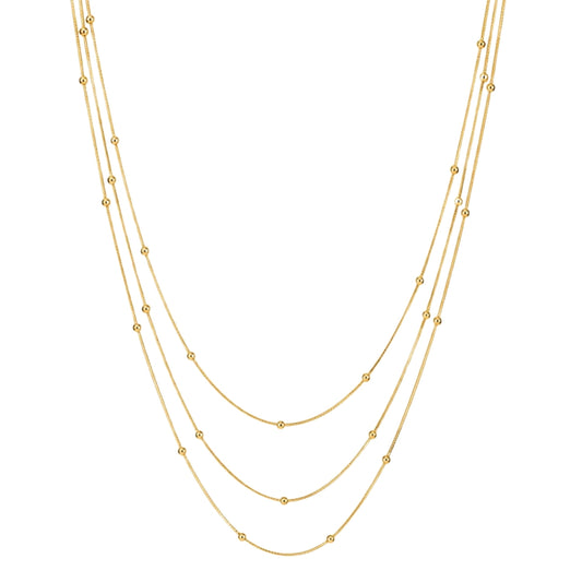 collar triple boho para adolescente o mujer joven que lleve escote palabra de honor, escote en v o escote pronunciado. es de 3 cadenas con bolitas. ideal para looks de noche o de fiesta. Es de acero hipoalergénico dorado o plateado y resistente al agua
