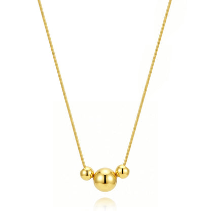 gargantilla boho para adolescente o mujer joven que lleve escote en v o escote pronunciado. es de cadena con bolas colgantes. ideal para looks de noche o de fiesta. Es de acero hipoalergénico dorado o plateado y resistente al agua