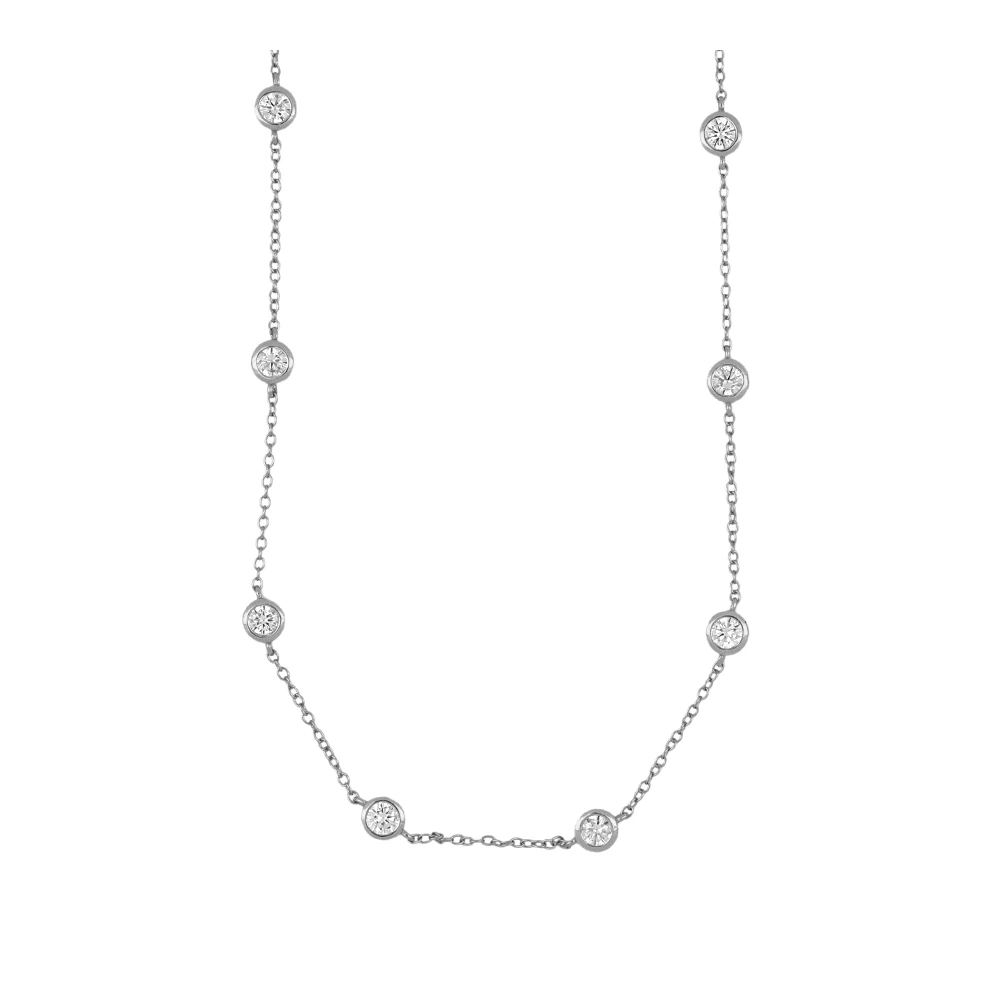 gargantilla de plata de ley con circonitas en círculo tipo punto de luz. Acabados en plata rodiada y baño de oro 18 kilates. Hipoalergénica. 