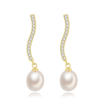 pendientes de fiesta largos con brillantes tipo tenis con perla es de plata de ley con baño de oro 18 kilates. gold plated sterling silver long zircon and pearl tennis chain holiday earrings