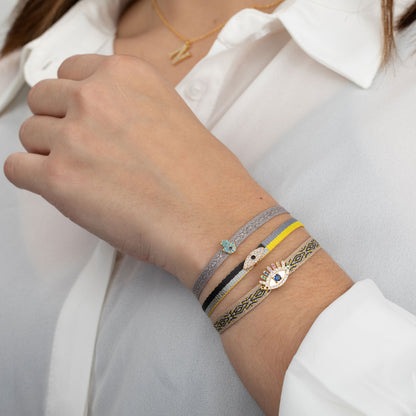pulsera ajustable de verano con cordón amarillo, gris, plata y negro con el ojo turco