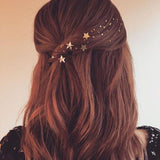 Pin de estrella dorada de pelo para peinados de invitada a boda