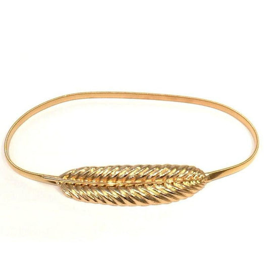 Cinturón elástico con una hoja o pluma en dorado para un vestido de boda