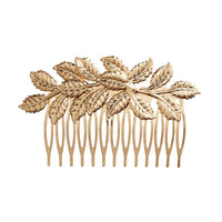 peineta de pelo dorada con hojas para adornar un peinado de invitada a boda